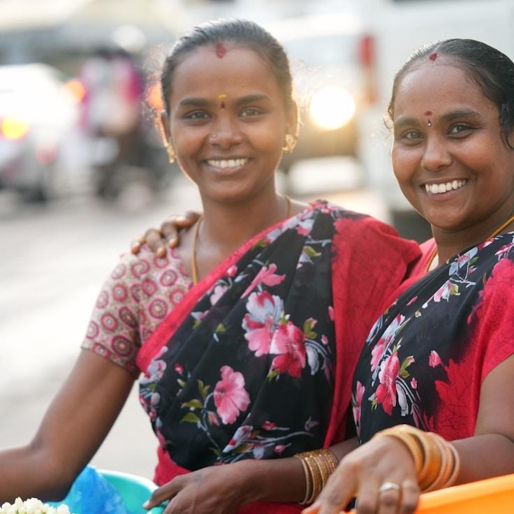 Ava Li, Lead Design Curator at Terravox Anlima, reviewing corporate floral arrangements